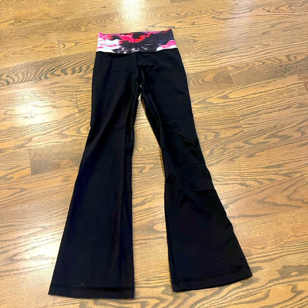 Size 6 Lululemon groove pant - black with multi color waistband. Flare bottom.